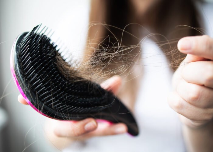 close-up-focus-on-the-arm-with-combs-and-hair-2025-01-07-09-45-16-utc