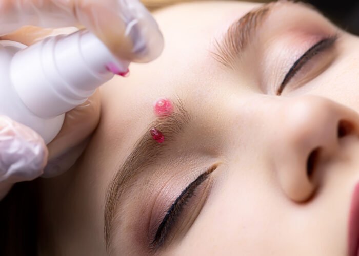lamination of eyebrows the master applies a cleansing foam to the eyebrow of the model